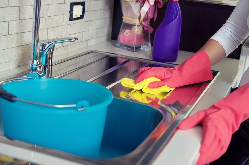 Protective gloves and cleaning equipment used during carpet cleaning
